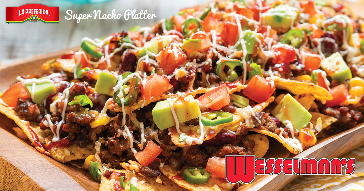 Plate of nachos with toppings.